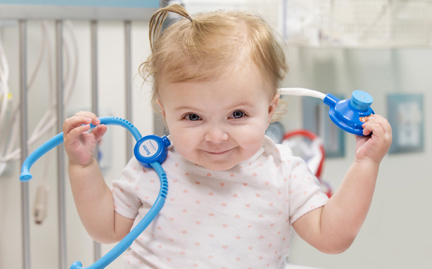 Baby with toy stethoscope